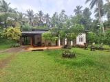 Road facing 120-Perches Land with House for Sale in Weliveriya.